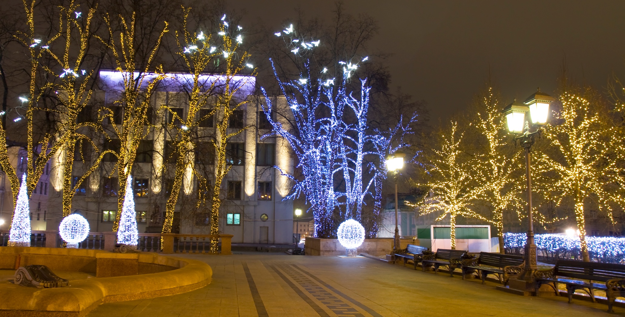 Glowing Christmas Lights And Trees On The Street