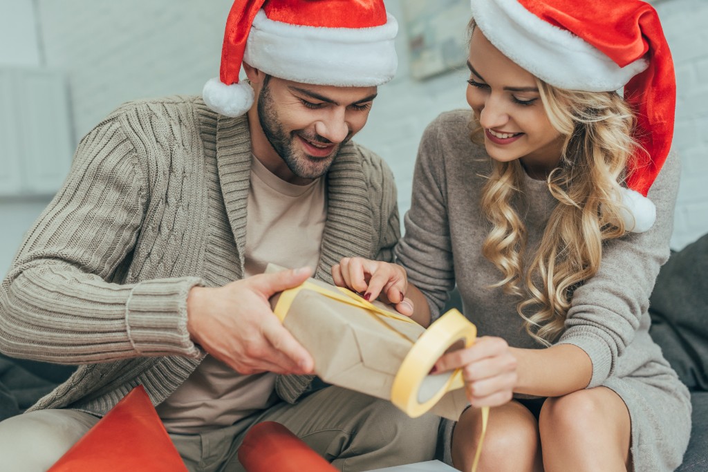 Couple Wearing Christmas Hats